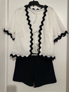 White short sleeve jacket  size L with black stretchy shorts size xl junior